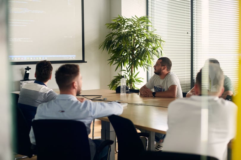 Software developers discussing a project during a team meeting