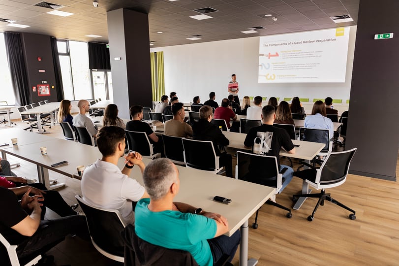 Students attending a presentation during a NetRom learning session.