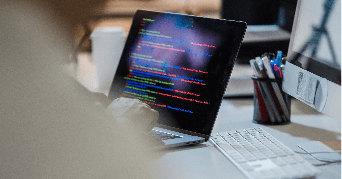 Software engineer reviewing code during a quality check