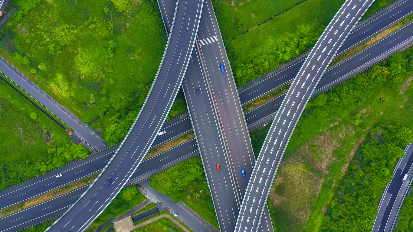 Aerial view of interconnected highways representing scalable fleet management infrastructure and data flows
