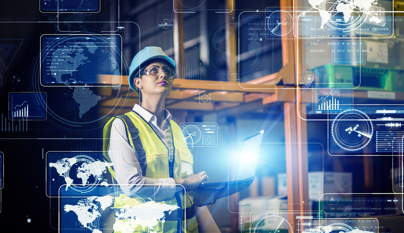 Logistics professional using digital dashboards to monitor connected devices in a scalable fleet management platform
