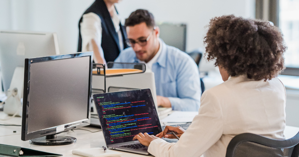 Software developer working with code in a technical work environment