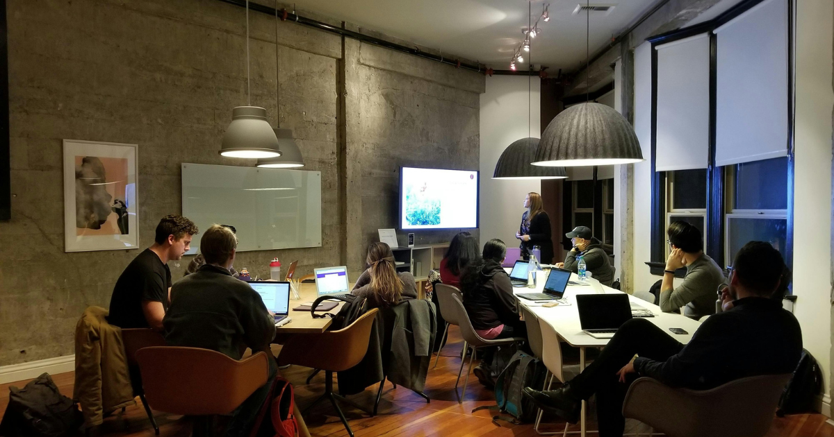 Software team attending a presentation during a collaborative working session.